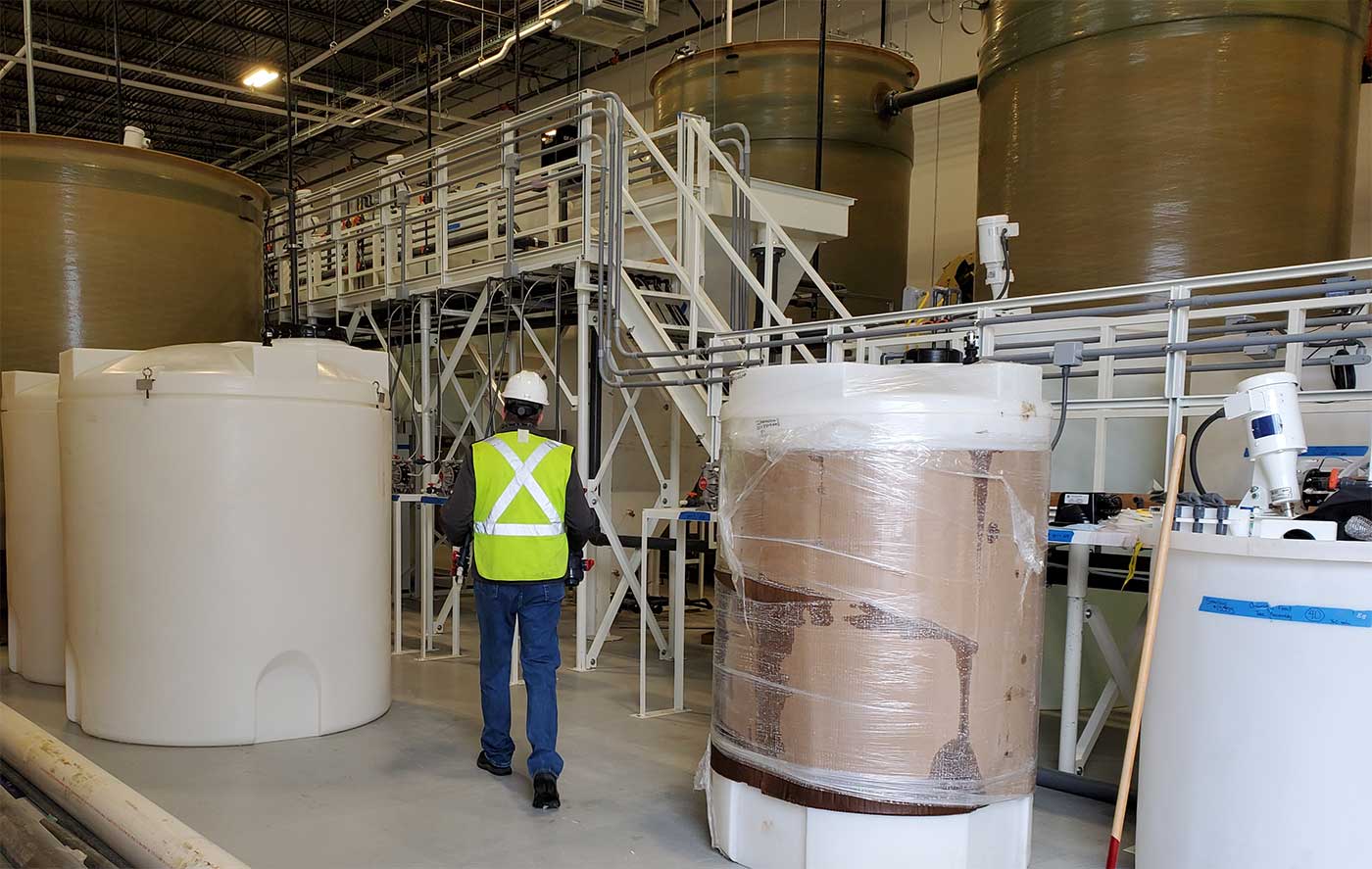 owner walking away from camera in a water treatment plant